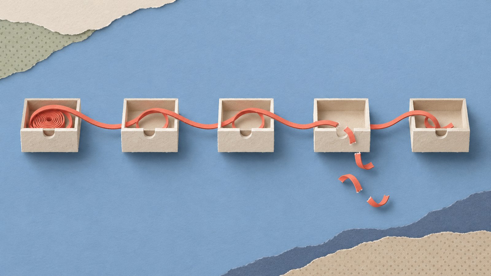 A coral paper thread winds through cream drawers, with one cut section and loose loops against a calm blue paper backdrop.